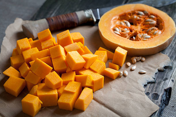 istock Orange long pumpkin cut into pieces 451924627