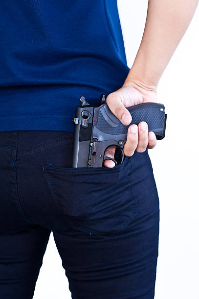 istock Gun In Woman Hand 451934899