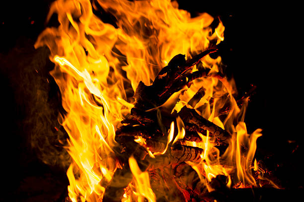 Bright flame of acute energy natural bonfire closeup, texture, background.