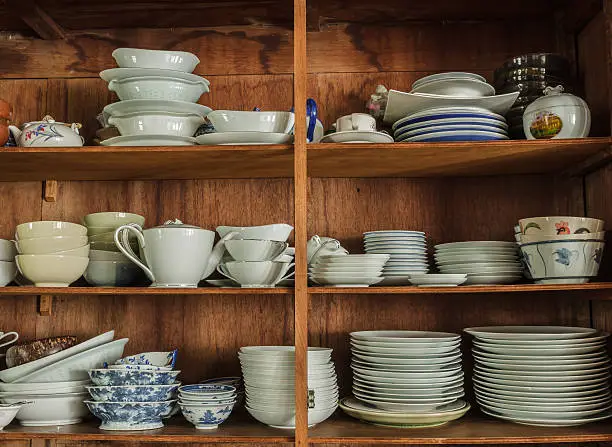 Wooden crockery in the pantry in the kitchen.