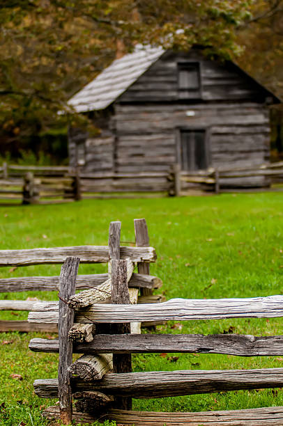 istock Beautiful Autumn scene showing rustic old log cabin surrounded b 451945689