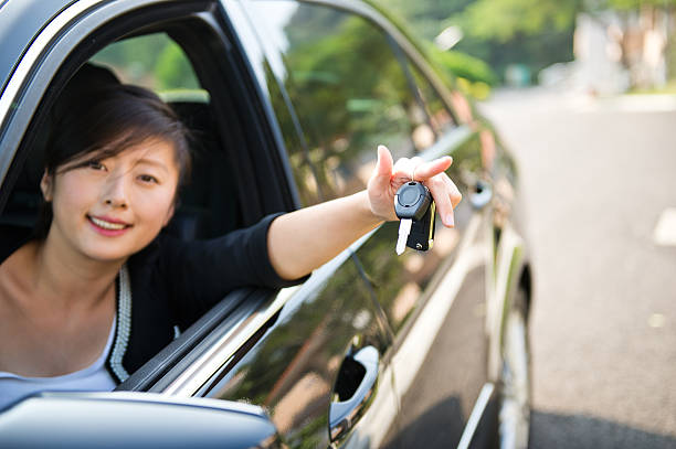 istock young woman with keys 451961537