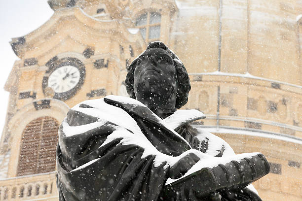 statue of Martin Luther in front of the Frauenkirche in Dresden on a cold day in winter. The statue was made by the German sculptors Adolf von Donndorf (1835-1916) and Ernst Rietschel (1804-1861) and moulded in Dresden in 1885 by Albert Bierling; Dresden, Germany