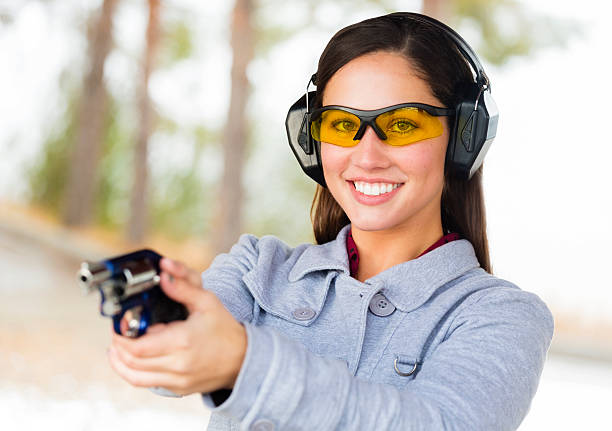 istock Young Woman at the Shooting Range 451963963