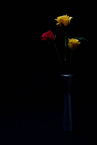 istock Yellow and red roses in vase 451964861