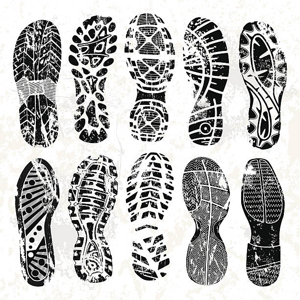 Grunge shoe tracks Collection of highly detailed grunge foot prints: running shoes white background stock illustrations