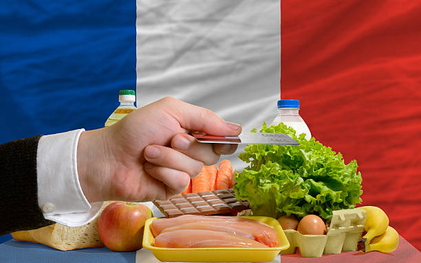 buying groceries with credit card in france stock photo