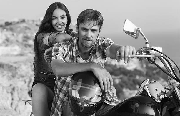 istock Biker man and girl 451984721