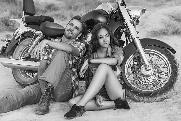 istock Biker man and girl 451985099