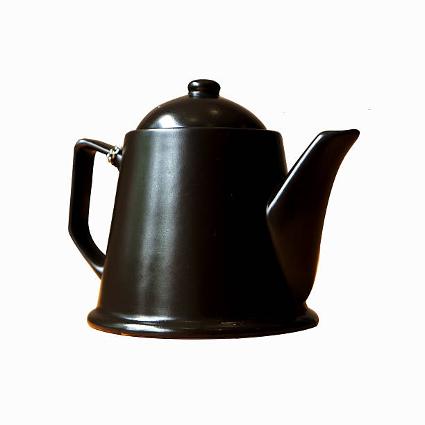 istock black tea pot, isolated on white background 451985425