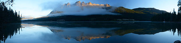 Panoramic Image Of Lucerne Peak Reflected in Yellowhead Lake stock photo