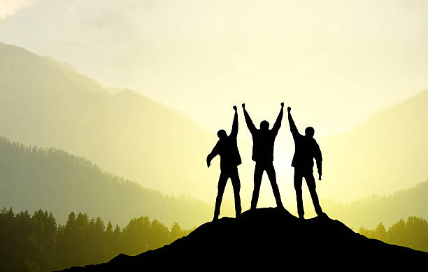 istock Silhouette of a team on a mountain 451991411