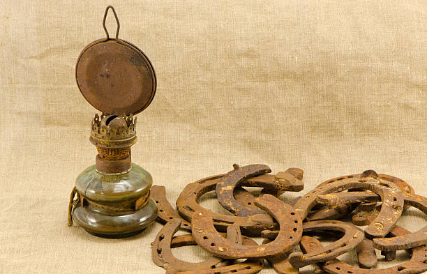 istock retro kerosene lamp rusty horse shoes linen 451991579