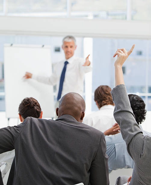 istock Businessman about to stand up during a pesentation 451993499