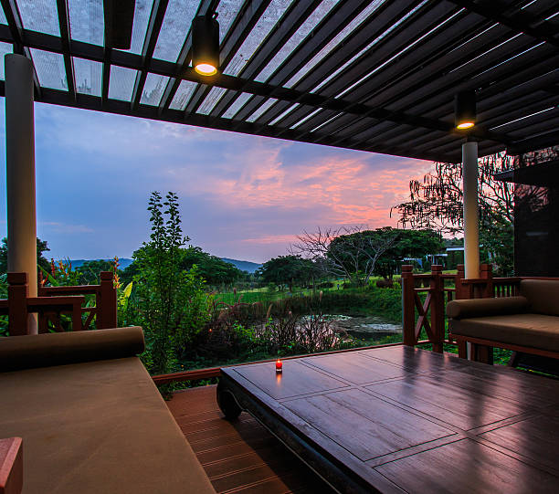 istock Contemporary terrace lounge with view of greenery at sunrise 452003995