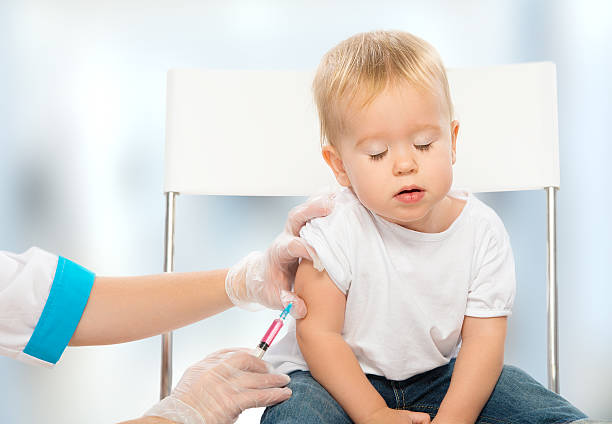 istock doctor does injection child vaccination baby 452017953