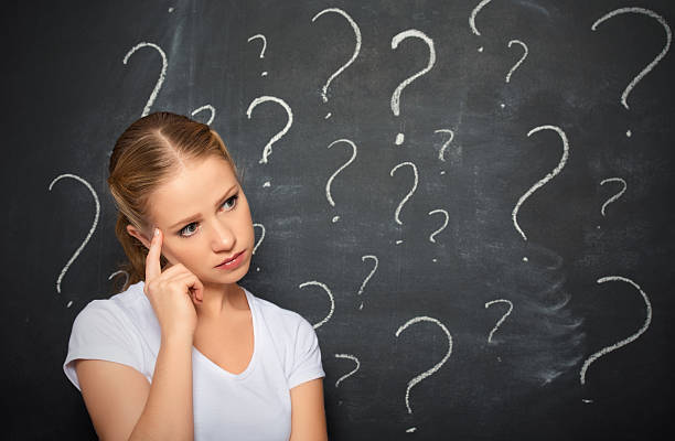 istock concept of woman question mark drawn in chalk on blackboard 452017965