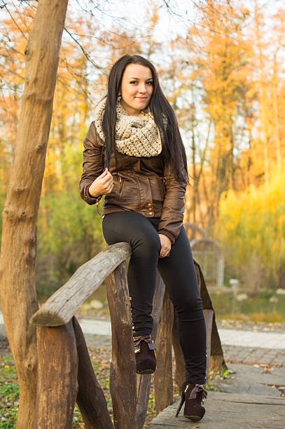 istock Young pretty woman in autumn park 452022081