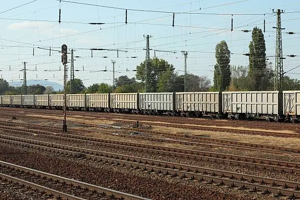 Many railway tracks with freight wagons