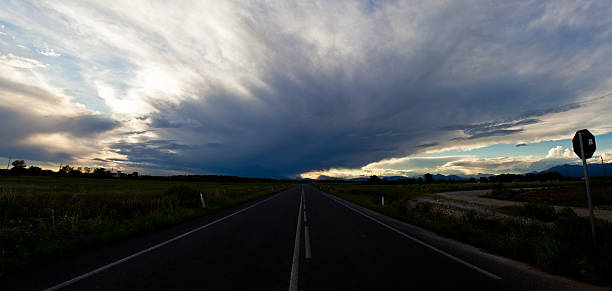 istock sunset on a country road 452023167