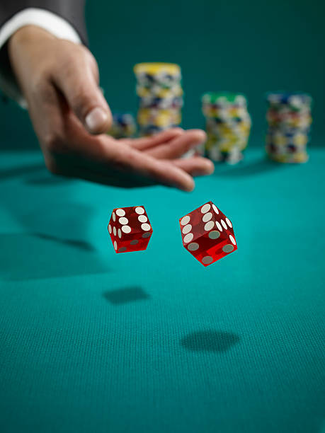 double seis - rolling dice imagens e fotografias de stock