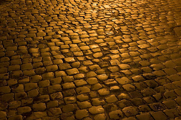istock Roman cobblestone at night, Rome Italy 452027517