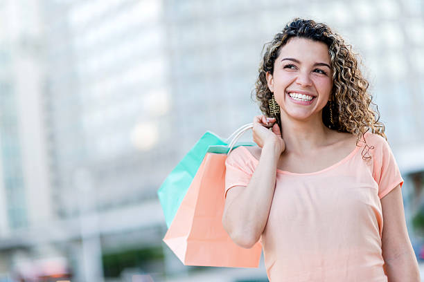 istock Young woman after shopping 452031799