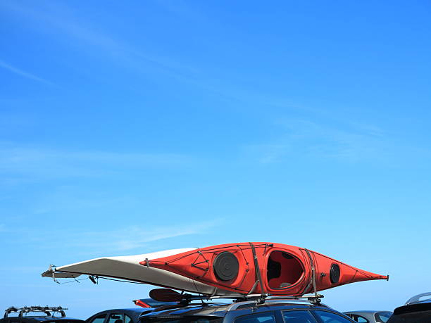 istock car with kayak canoe on top blue sky. Active lifestyle 452049471