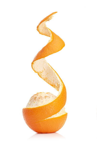 istock orange with peeled spiral skin 452050853