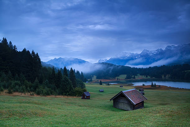 istock wooden hut on meadow by Geroldsee lake 452051903