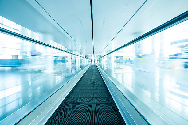 istock escalator ,interior of airport 452056279