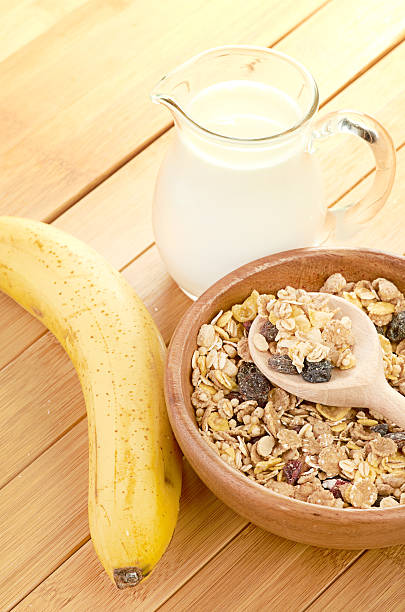 istock Plate with raw oatmeal on wooden table. 452065667