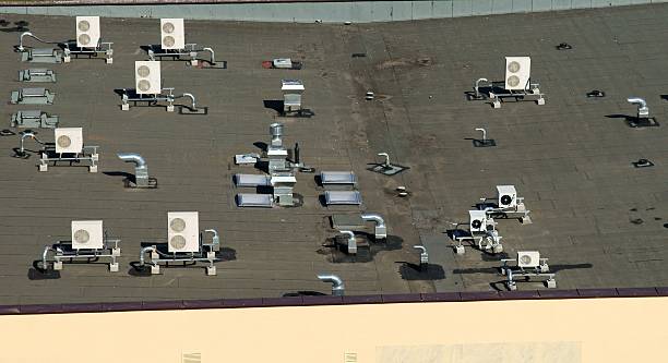 istock air condition outlets over black roof 452069039