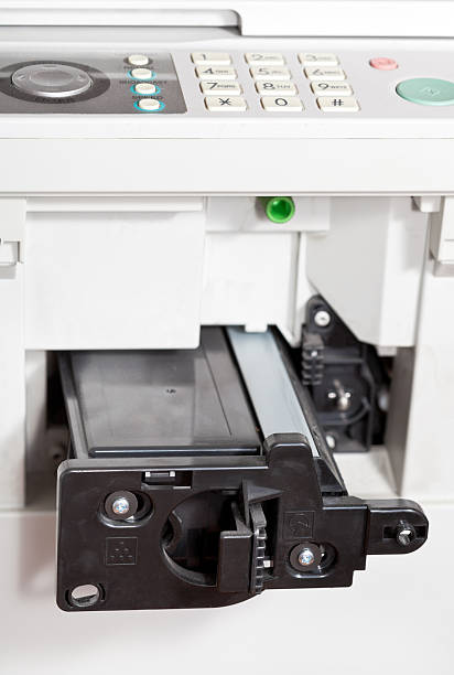 istock inserting of toner cartridge in office copier 452069211