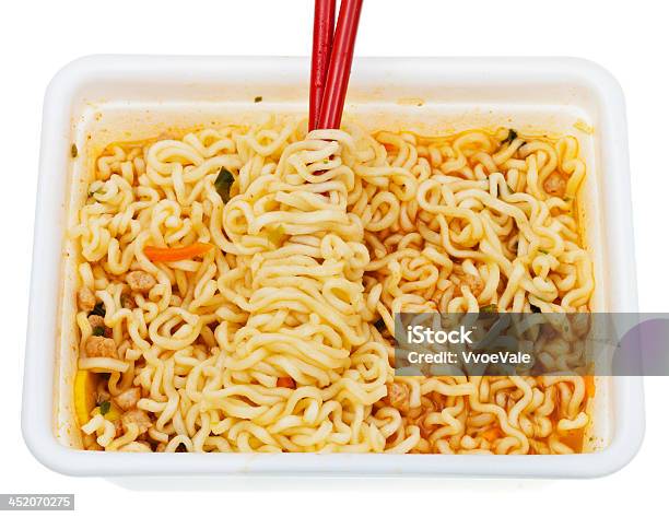 Eating Of Instant Ramen From Lunch Box Stock Photo - Download