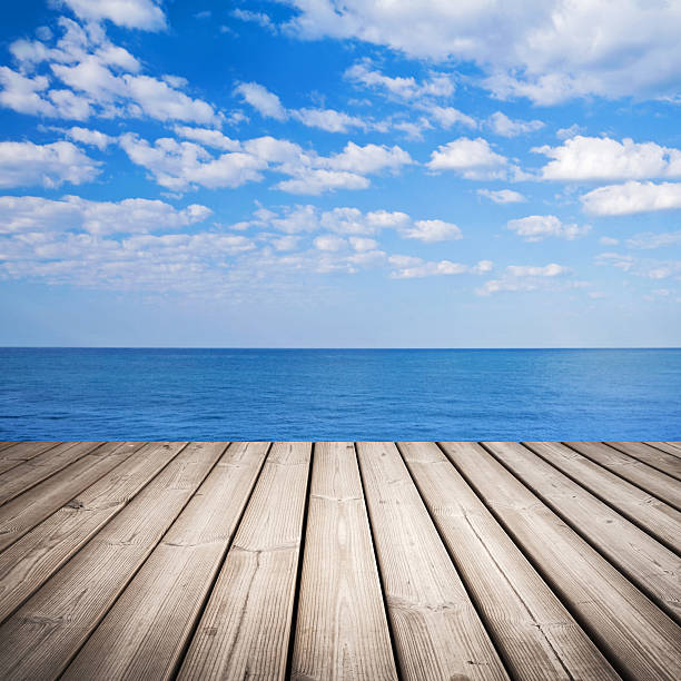 istock Empty wooden pier with sea and cloudy sky on background 452070639