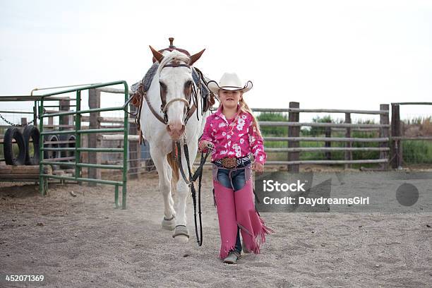 Little Cowgirl Walking With Horse Stock Photo - Download Image Now - Horse, 6-7 Years, Activity