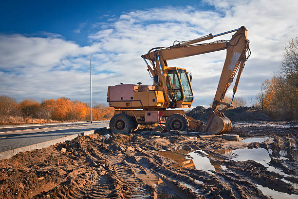 istock Excavator in a new road construction 452072523