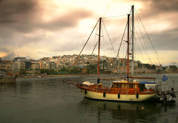 Wooden sailboat is coming in marina of Zea,Piraeus Port,Athens,Greece