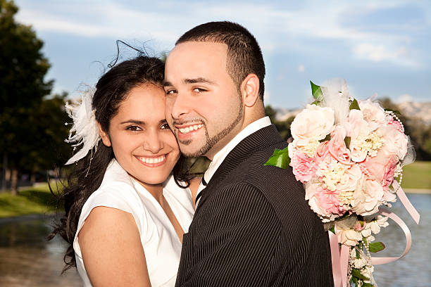 Bride and Groom outside.  Mountains and lake background.