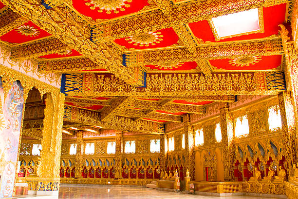 istock Buddha temple wall and thai style ceiling decoration 452094425