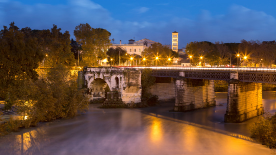 Tiber River and Ponte Rotto at dusk, Rome Italy