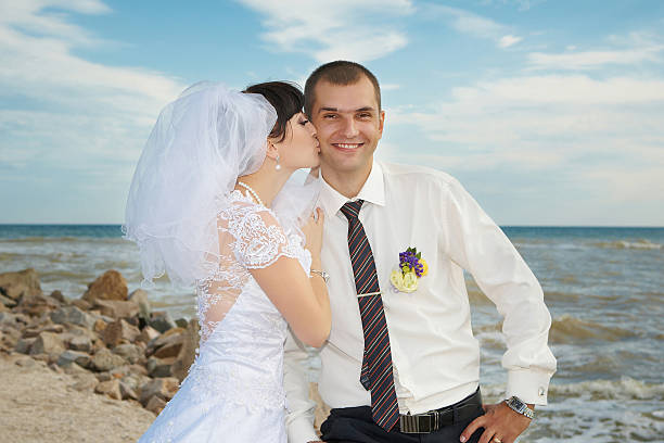 istock bride and groom gentle kiss 452103325