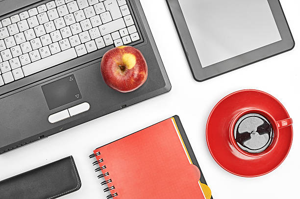 istock Laptop and office supplies on white 452107293