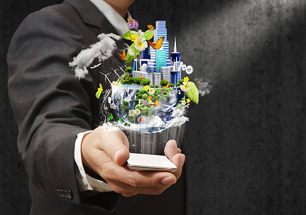 Businessman holding a mobile phone sending images