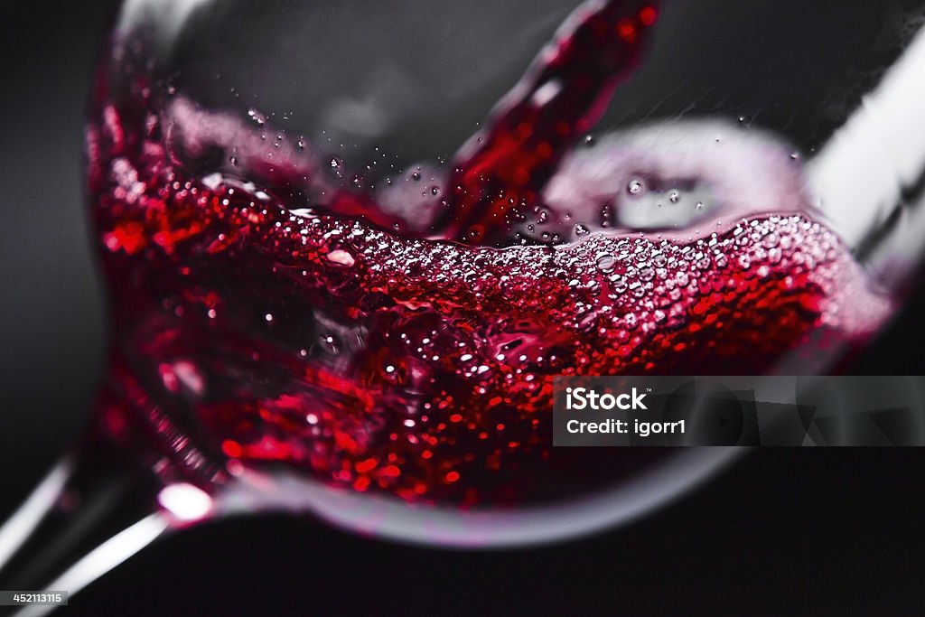 Red wine Red wine in wineglass on  black background Wine Stock Photo