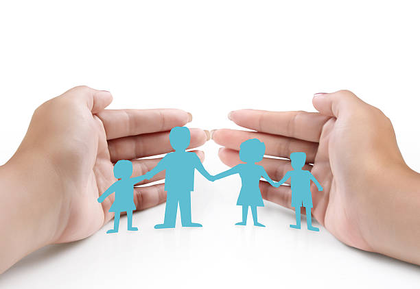 istock ideas,paper family in  hand 452123949