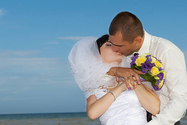 istock bride and groom gentle kiss 452124999