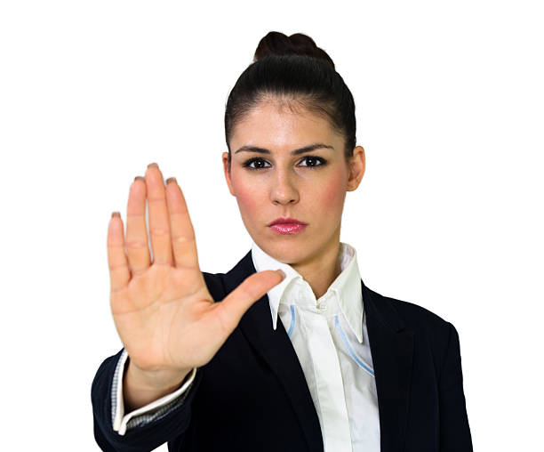 istock Young angry business woman with stop hand gesture 452125155