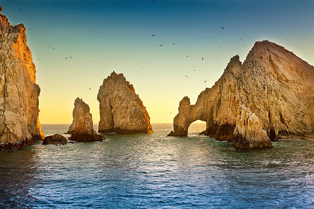 Landscape view of Lands End with ocean and large rocks Natural rock formation at Land's End, in Cabo  San Lucas, Mexico sea of cortes stock pictures, royalty-free photos & images